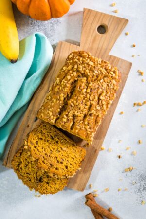 Pumpkin banana bread on a wooden chopping board