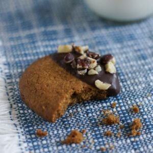 A bite taken out of a hazelnut butter cookie.