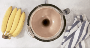 picture of a blender mixing banana Nutella Milkshake ingredients