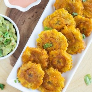 Tostones on a white serving plate