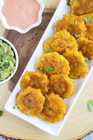 Tostones on a white serving plate