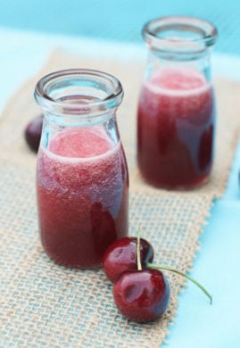 Two bottles of cherry simple syrup.