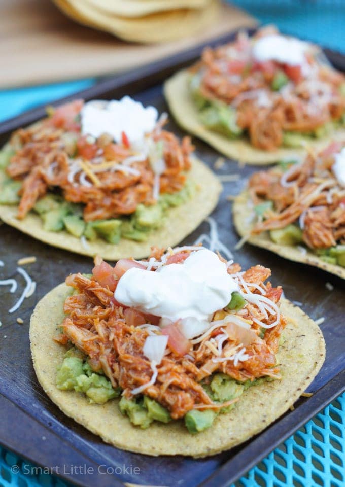 Chipotle chicken tostadas topped with sour cream.