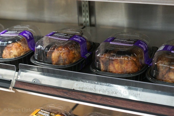 Packages of rotisserie chicken in a store.