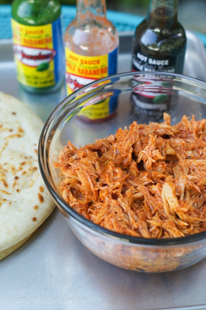 The buffalo shredded chicken in a glass bowl.