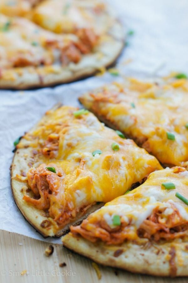 Cheesy, crispy, spicy and full of flavor! The perfect Game Day Buffalo Chicken Mini Pizza.