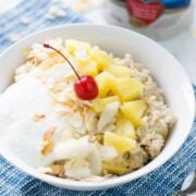 Pina colada oatmeal served in a white bowl.