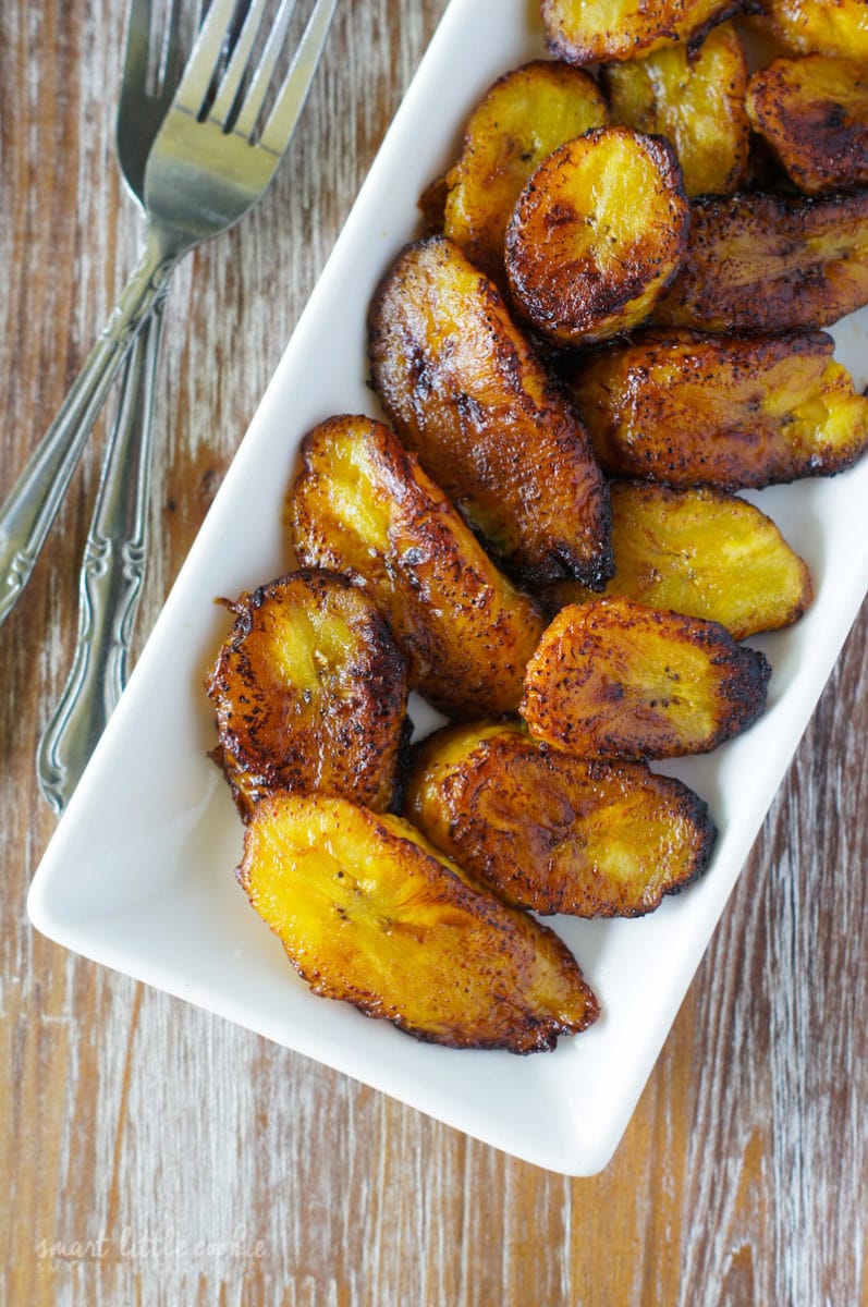 Sweet plantains slices fried to perfection served in white dish.