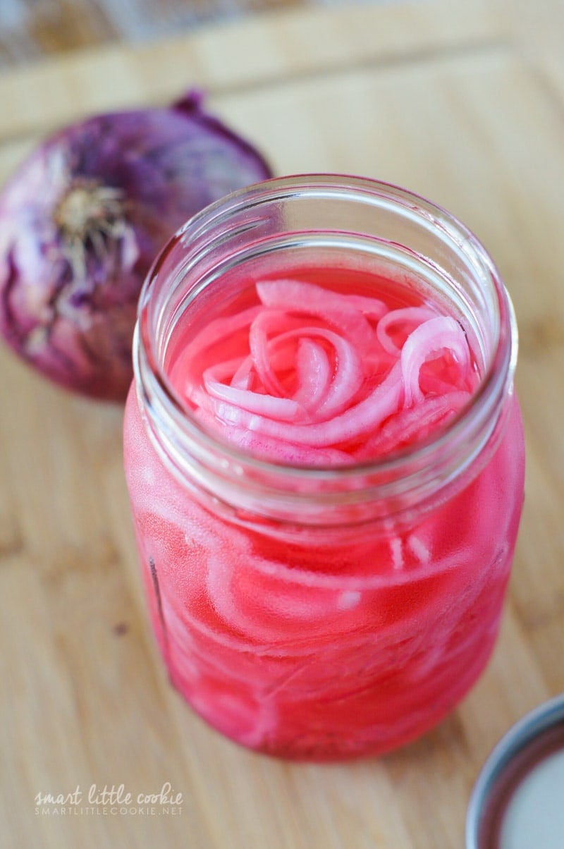 The jar of sliced onions filled with liquid.