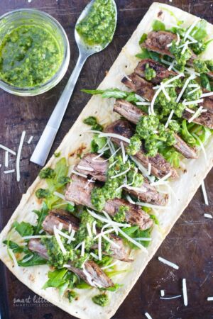 Churrasco pizza topped with chimichurri sauce.