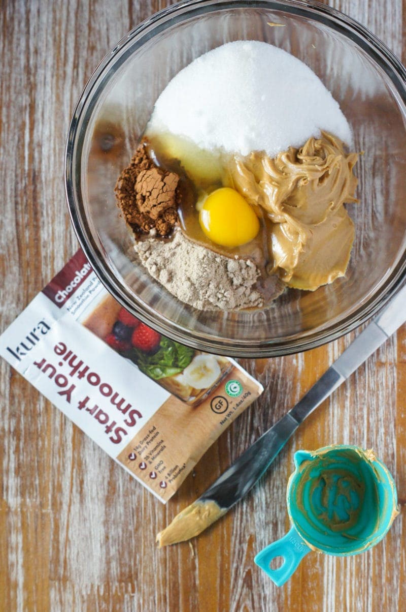 ingredients for flourless protein chocolate peanut butter cookies in a bowl
