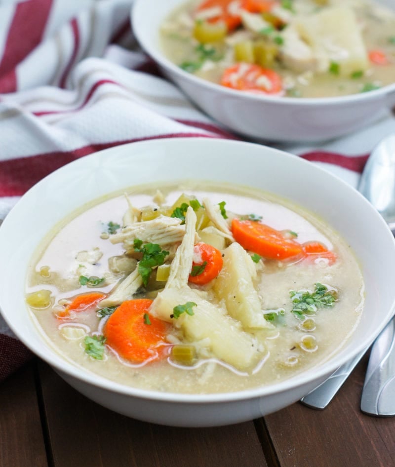 Slow Cooker Chicken Noodle Soup with Yuca on a white bowl