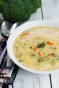 A simple cheese broccoli soup recipe that is easy to make and filled with delicious cheddar cheese, broccoli and carrots. smartlittlecookie.net #soup