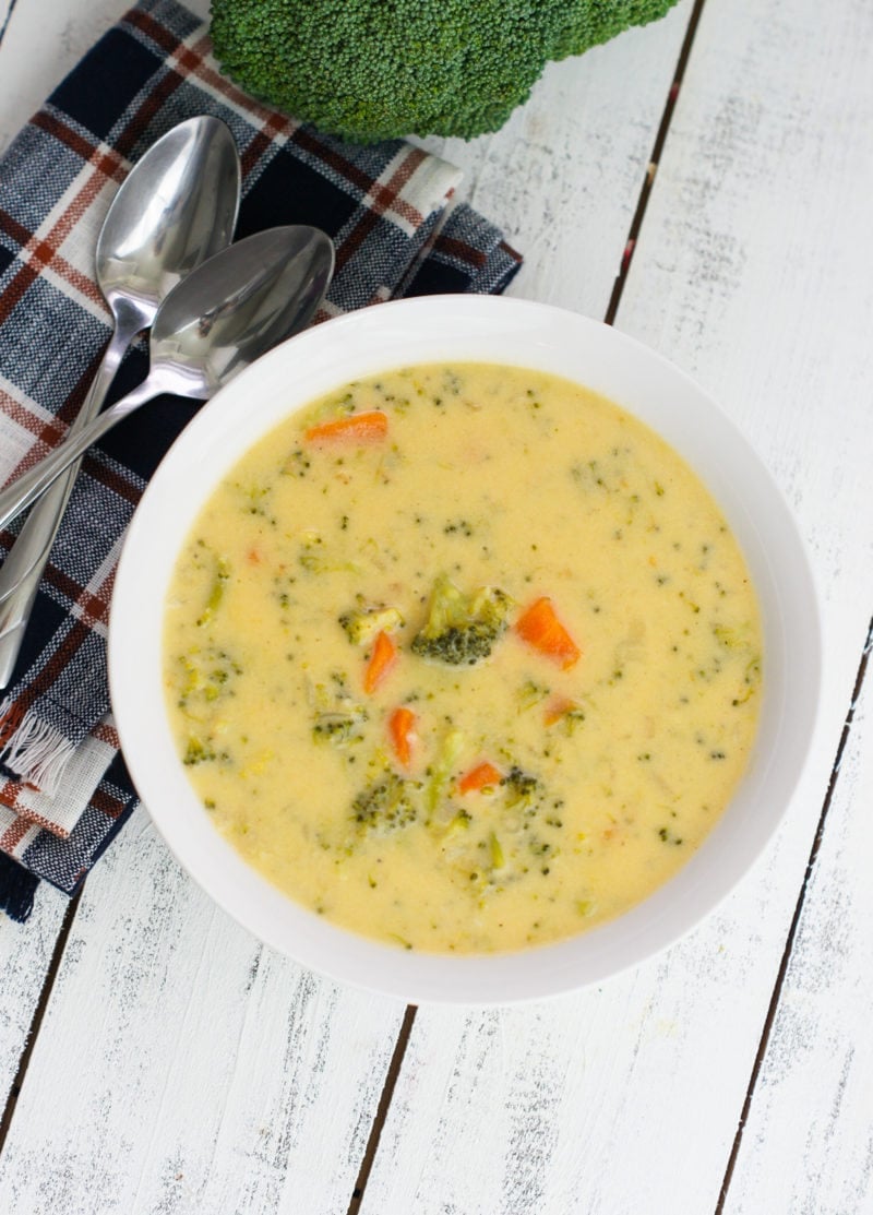 A simple cheese broccoli soup recipe that is easy to make and filled with delicious cheddar cheese, broccoli and carrots. mydominicankitchen.com #soup