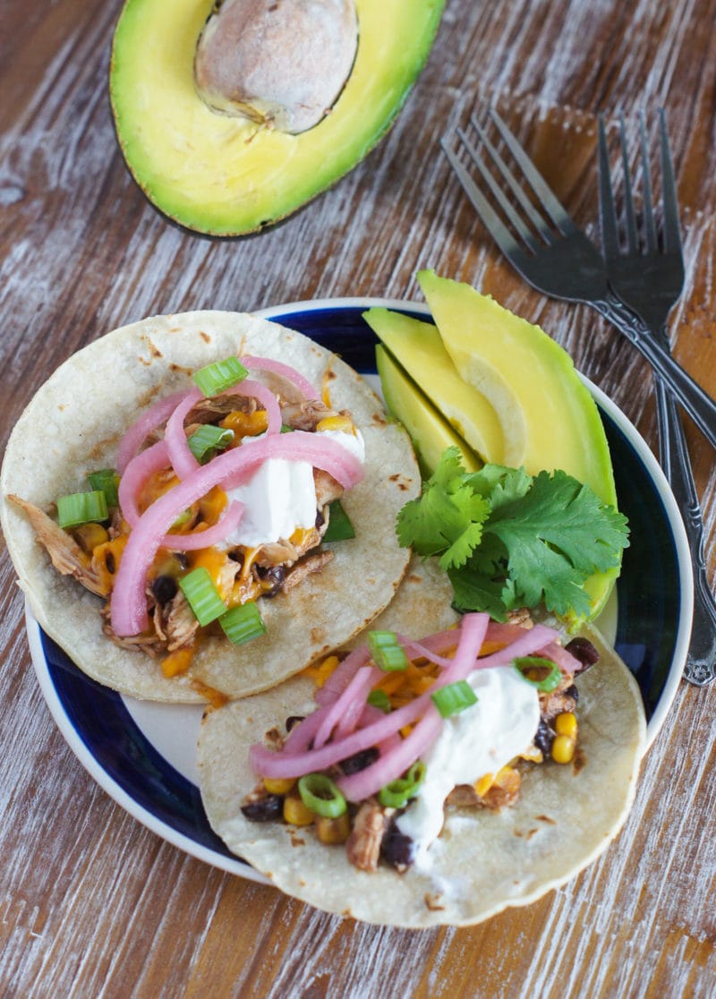 Chicken Chili Tacos ~ The easiest, quickest and most flavorful tacos made with the best leftover slow cooker chicken chili, corn tortillas, avocados, pickled onions and sour cream. 