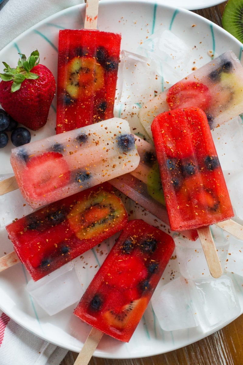 Fruit and lemonade popsicles on a large plate