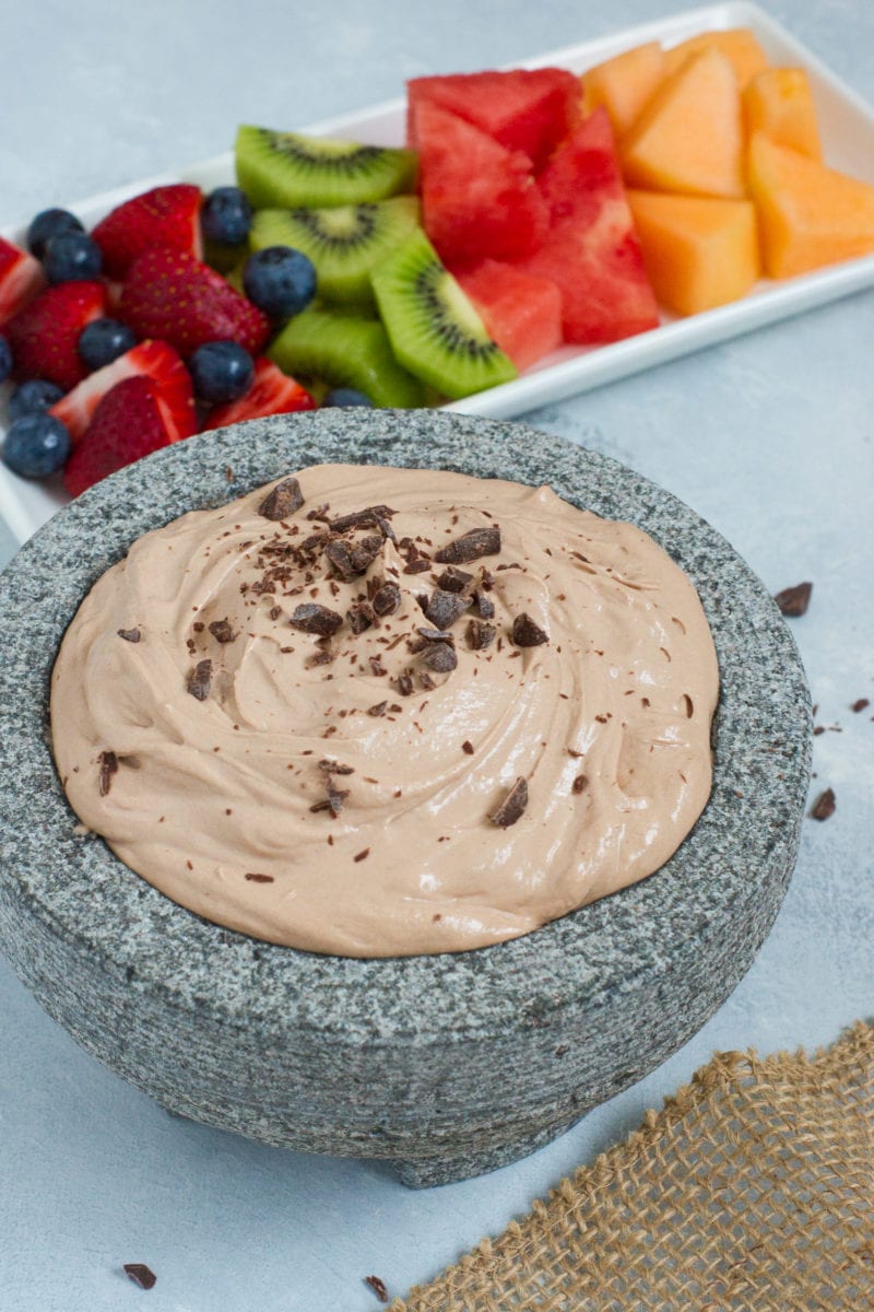 Chocolate fruit dip served in a grey bowl.