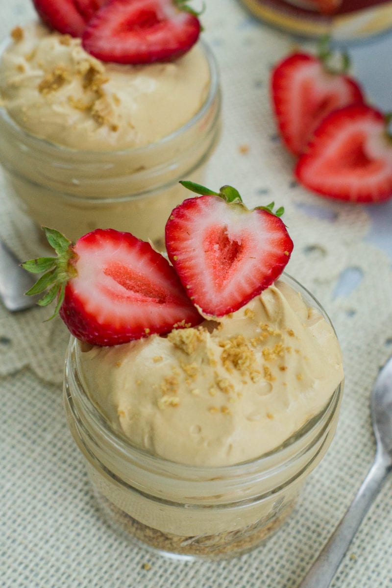 Dulce de leche cheesecake served in a small glass jar.