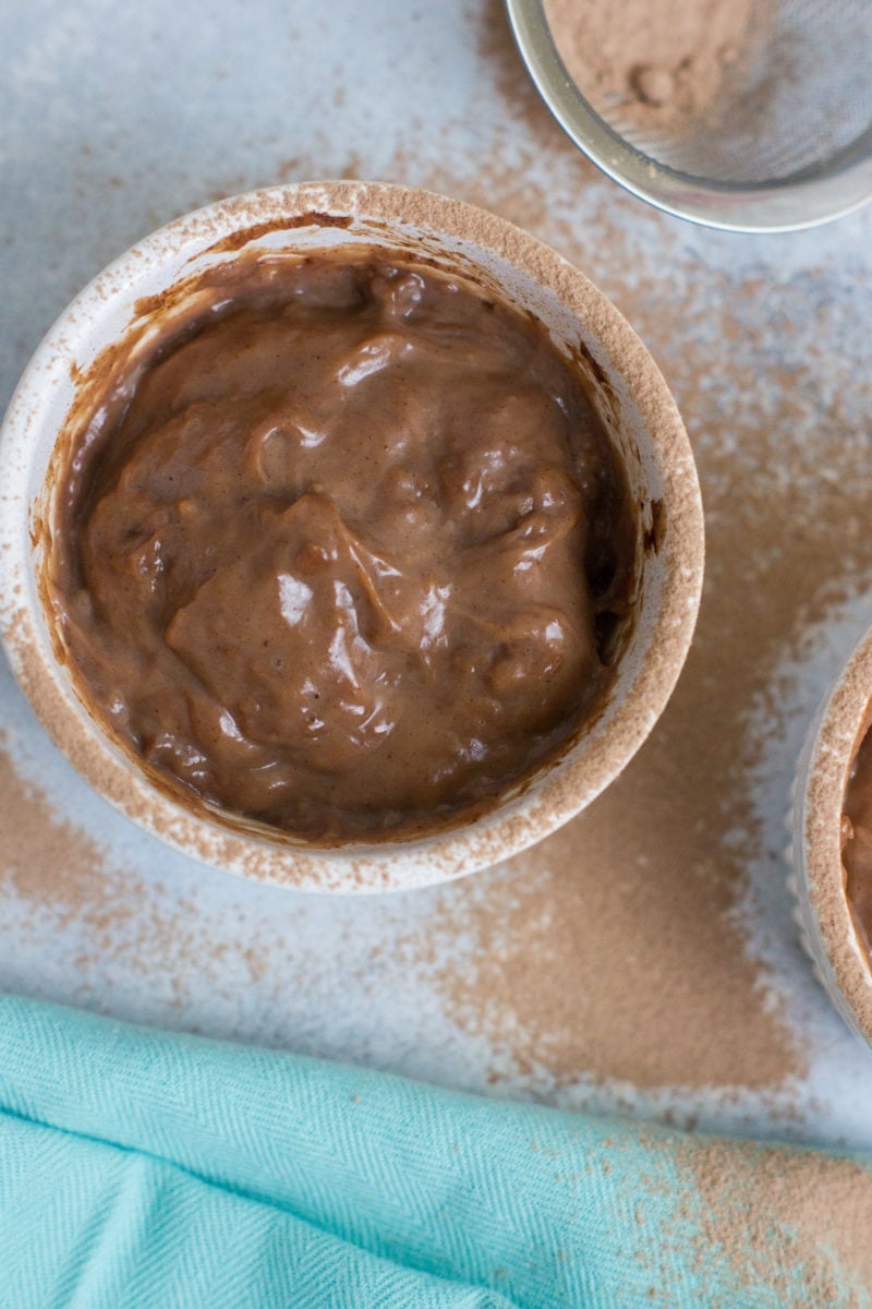 Chocolate pudding dusted with cocoa powder.