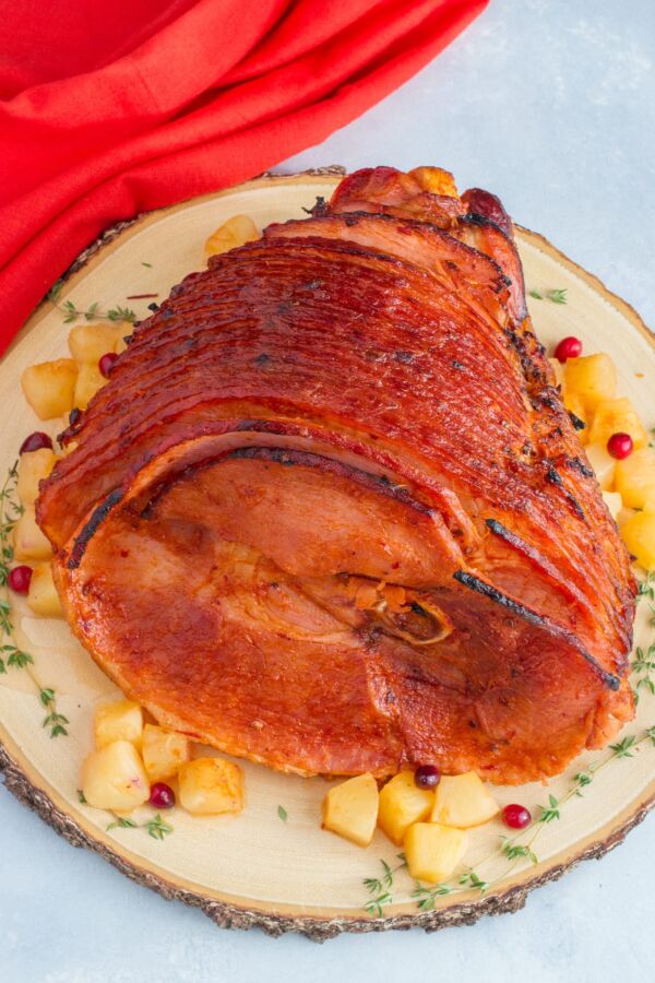 Pineapple chipotle glazed ham on a serving plate.