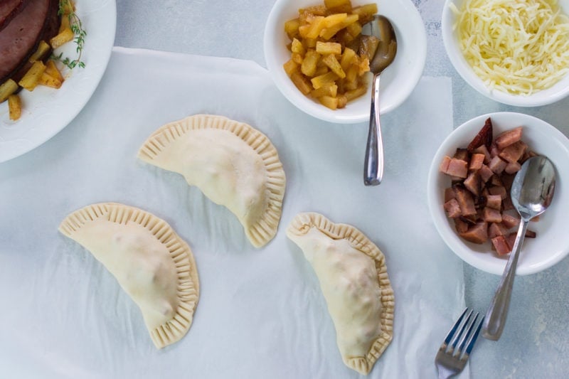 The empanadas folded before being baked.