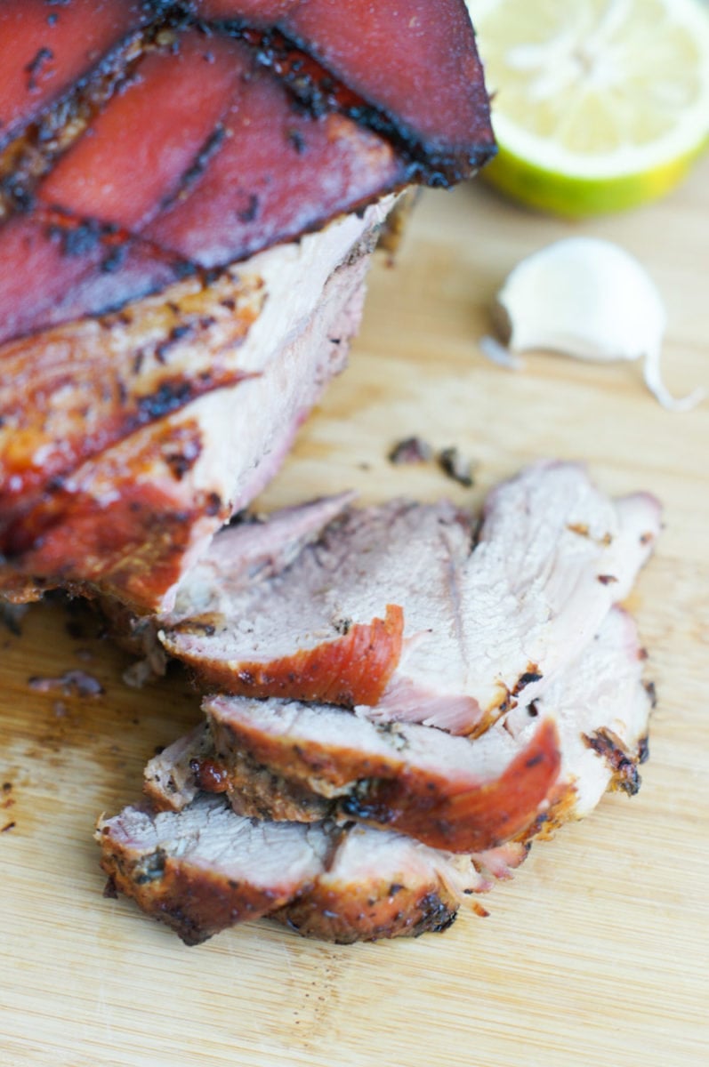 Cuban Style Roasted Pork Shoulder cut on a wooden board