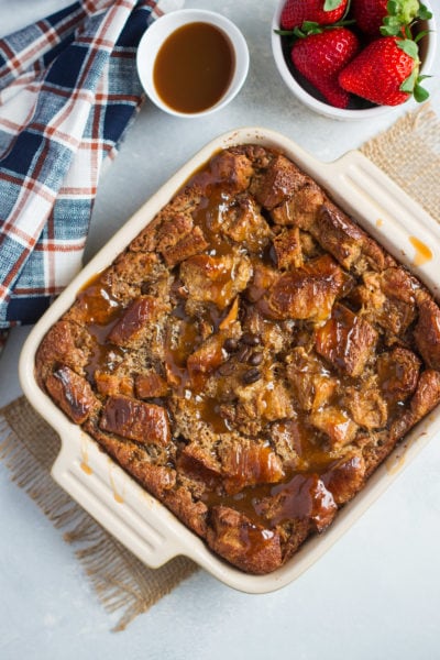 Bread pudding in a white baking dish ready to serve.