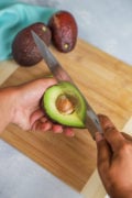 removing avocado pit with a knife