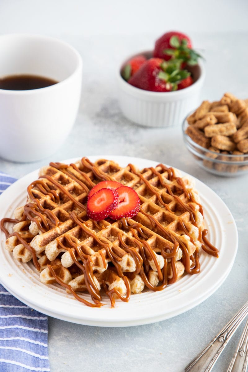 Churro Waffles with Dulce de Leche served on a plate