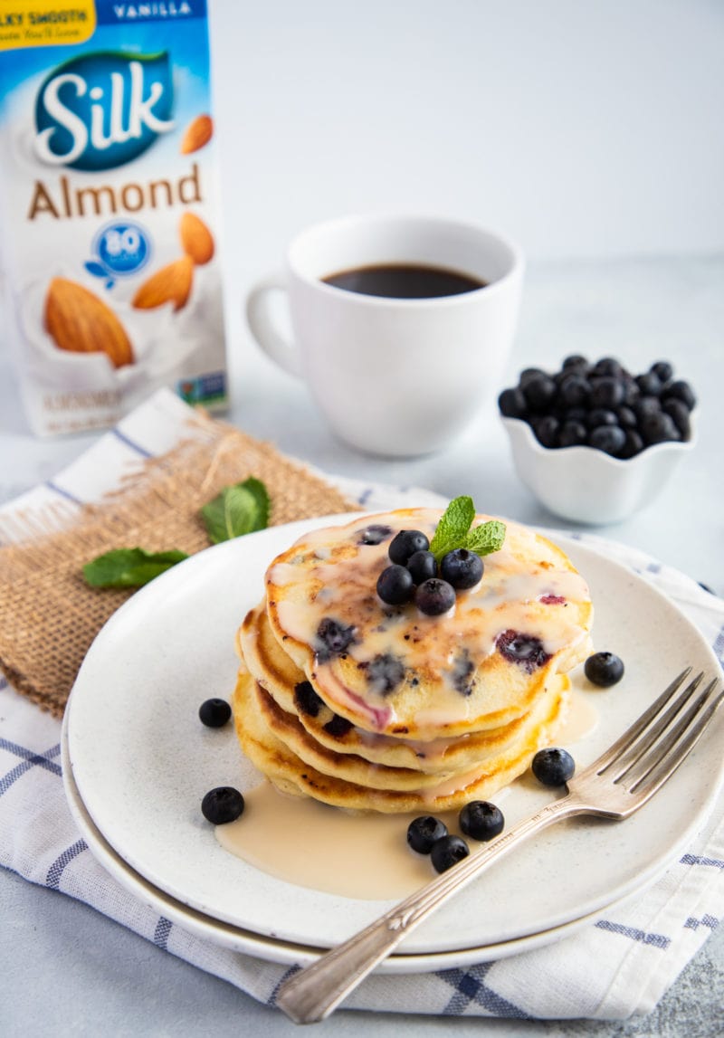 Blueberry Pancakes on a plate with vanilla glaze