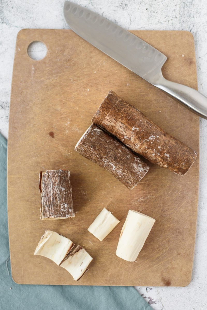 Peeled Yuca root on a cutting board