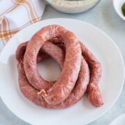Uncooked Dominican Longaniza on a plate