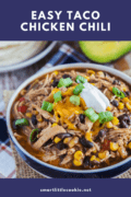 Slow cooker taco chicken chili in a blue and white bowl with toppings pinterest image collage