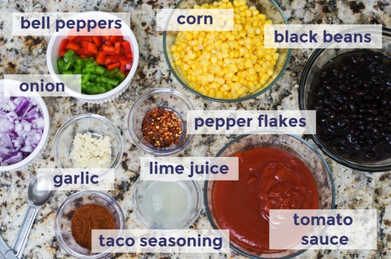 Slow cooker taco chicken chili ingredients laid out on a counter