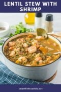 lentil stew with shrimp in a dutch oven on the table