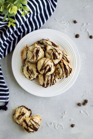 Chocolate Coconut Macaroons layered on a white plate