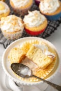 coconut tres leches cupcake on a white plate