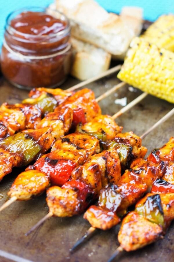 honey chipotle chicken skewers on a baking sheet