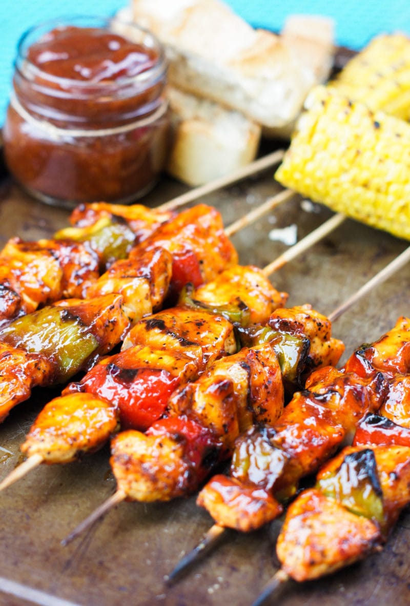 honey chipotle chicken skewers on a baking sheet