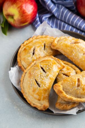 Apple empanadas on a gray plate