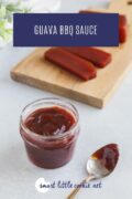 Guava bbq sauce in a glass jar next to a spoon pinterest image 2