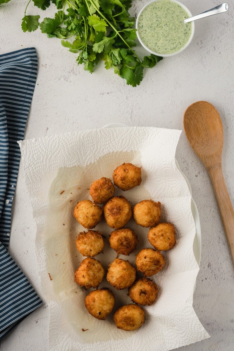 The fried balls laid on parchment