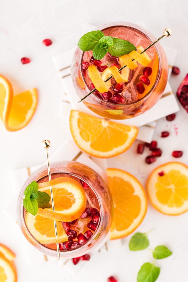 Overhead shot of two glasses of pomegranate sangria.
