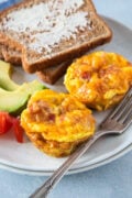 Close up of Bacon and Egg Muffins served with toast and avocado