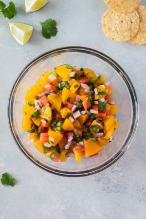 peach salsa in a clear bowl