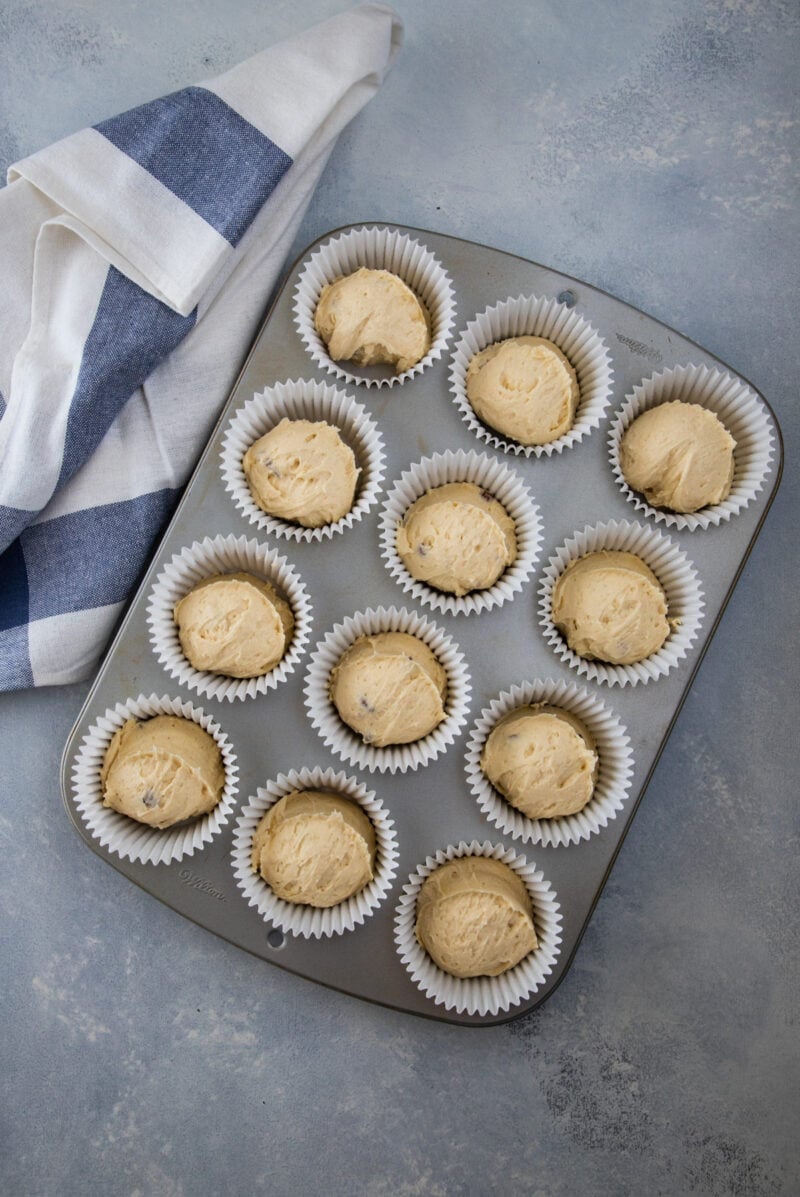 almond cupcakes batter in a muffin pan ready to bake