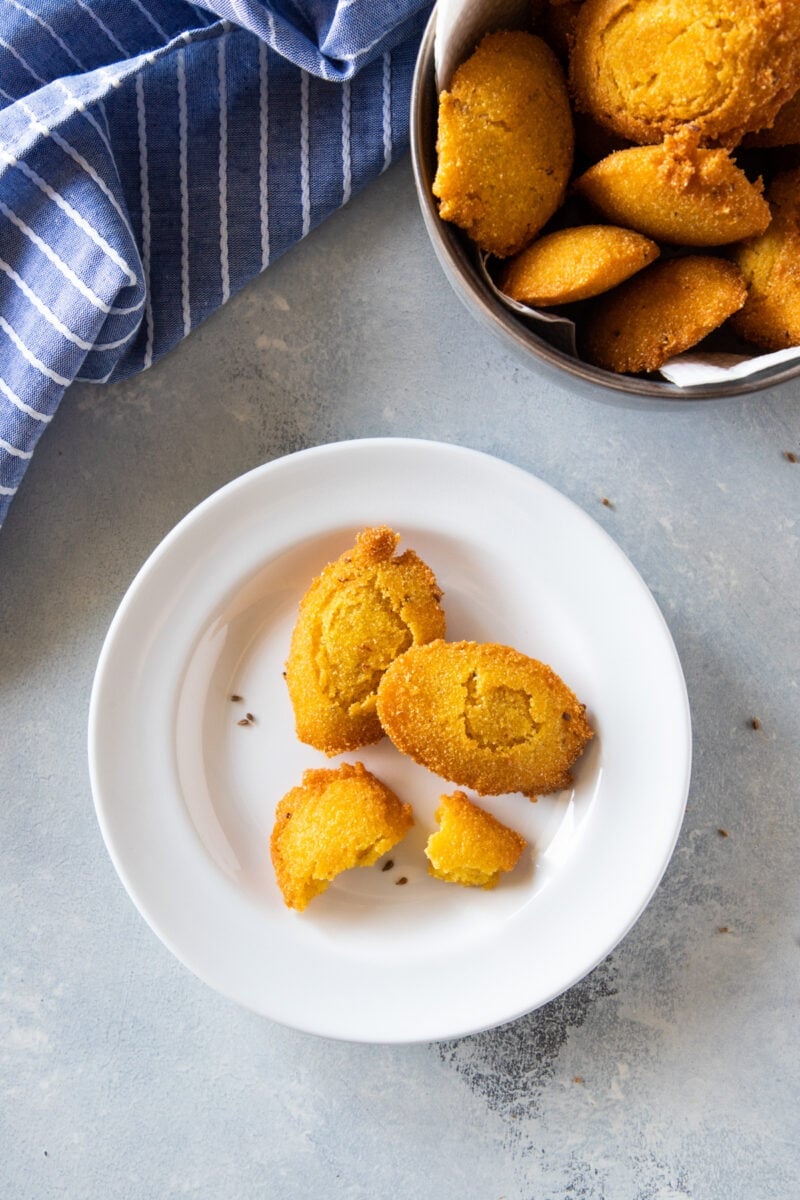 Cornmeal Fritters (Arepitas de Maiz) served on a white plate