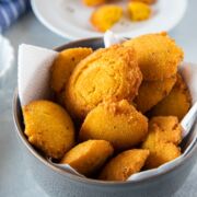 Cornmeal Fritters (Arepitas de Maiz) in a gray bowl