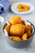 Cornmeal Fritters (Arepitas de Maiz) served in a gray bowl