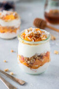 papaya yogurt parfait layered in a glass